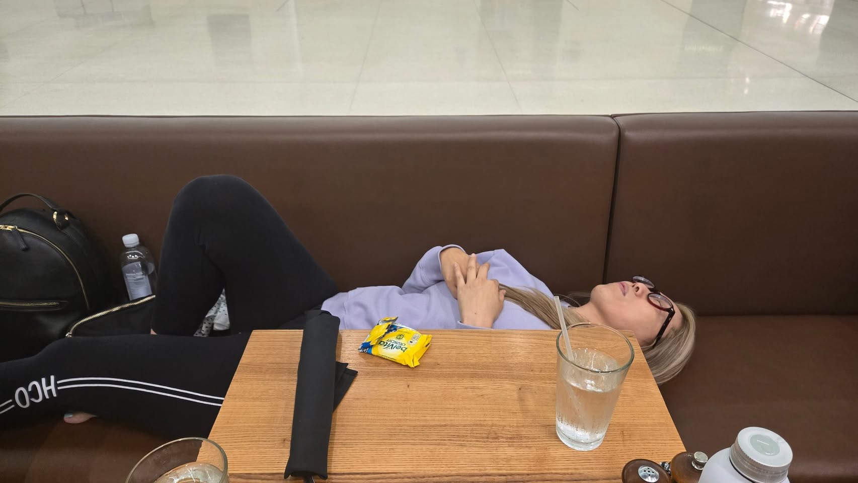 The airport nap. Jet lag is undefeated, but she's still beautiful when she sleeps.