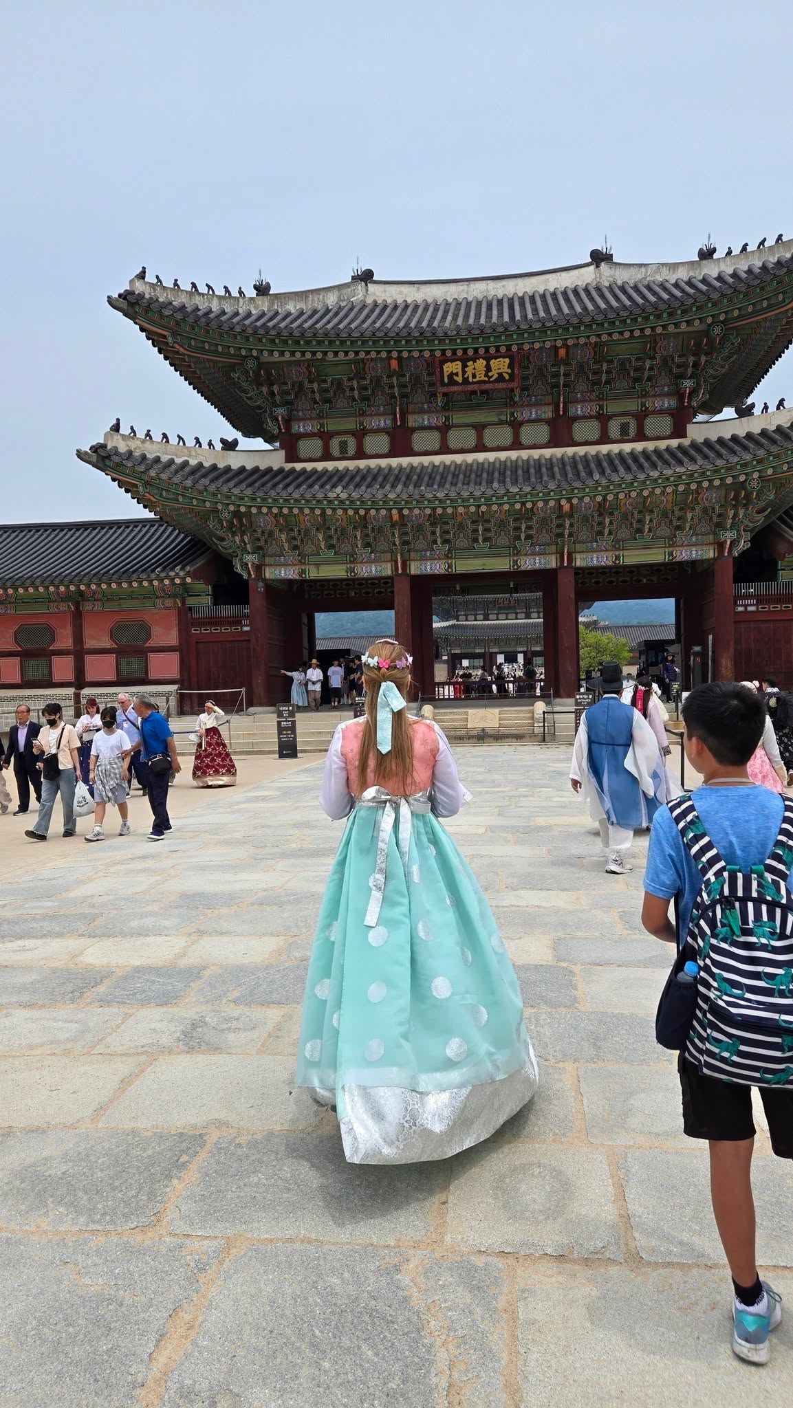 Walking through the palace grounds in traditional dress. Stunning.